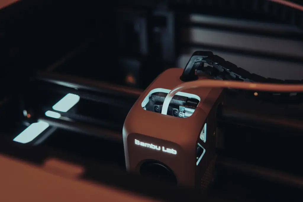 A high-tech 3D printer in action with a sleek design